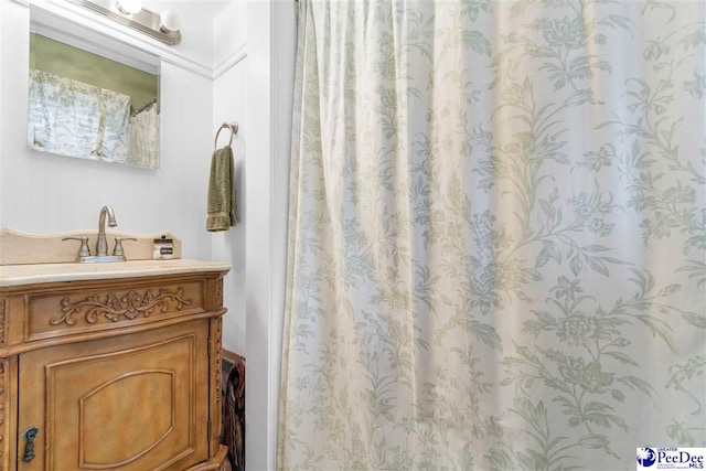 bathroom with vanity and curtained shower