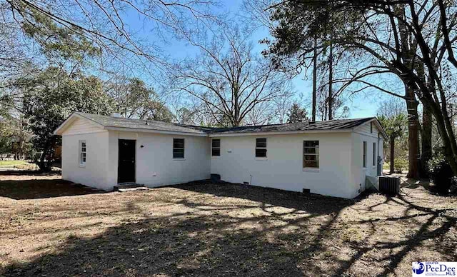 rear view of property with central air condition unit