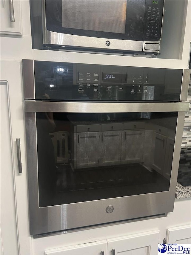 room details featuring appliances with stainless steel finishes