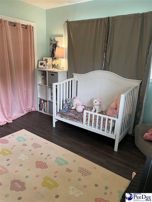 bedroom with wood finished floors