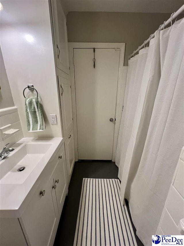 full bath featuring vanity
