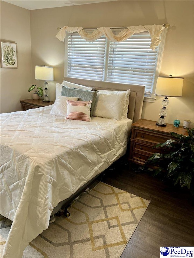 bedroom featuring wood finished floors