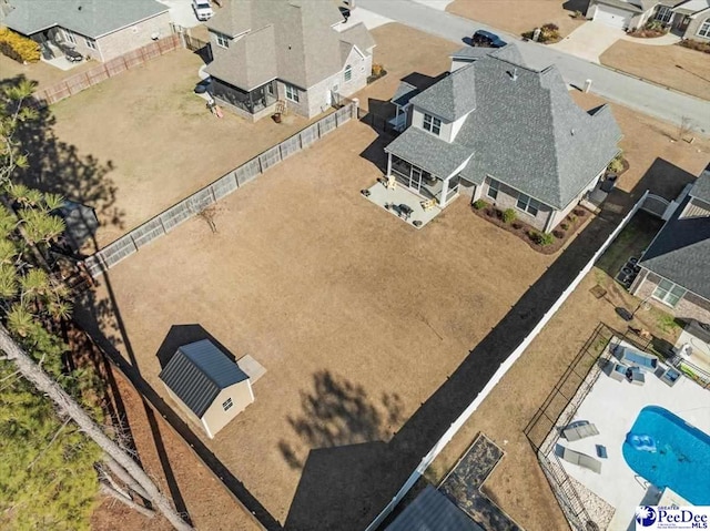 birds eye view of property with a residential view