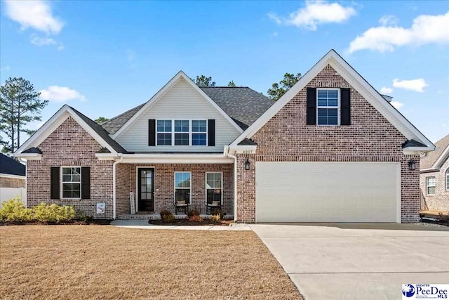 view of front of house with concrete driveway, an attached garage, brick siding, and a front lawn