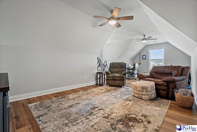 living room with ceiling fan, baseboards, lofted ceiling, and wood finished floors