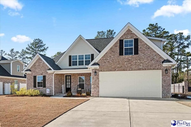 view of front facade with brick siding, concrete driveway, a garage, and a front yard