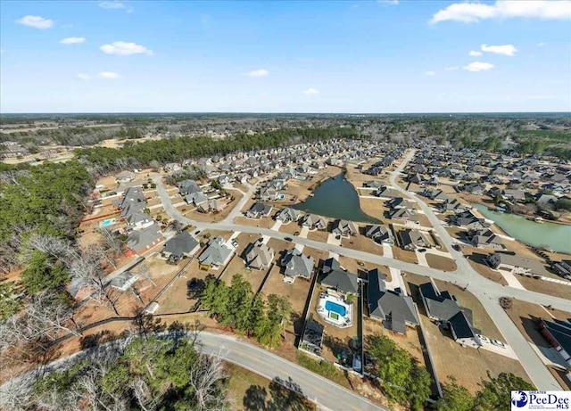 bird's eye view with a residential view and a water view