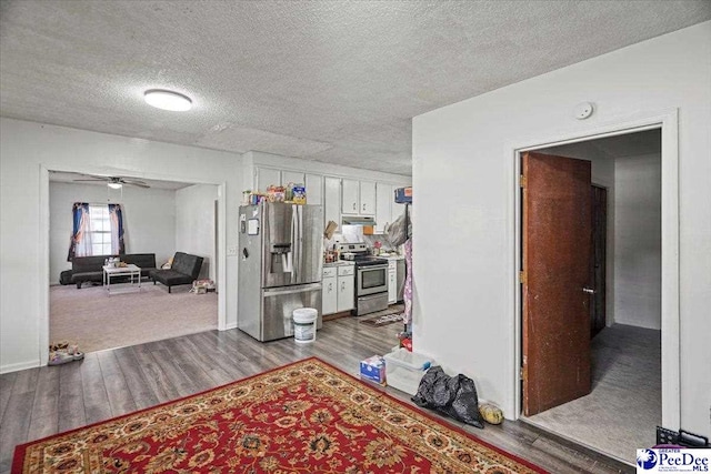 hallway featuring a textured ceiling and light wood-type flooring