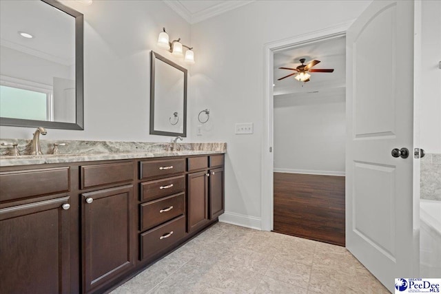 bathroom featuring double vanity, a sink, and ornamental molding
