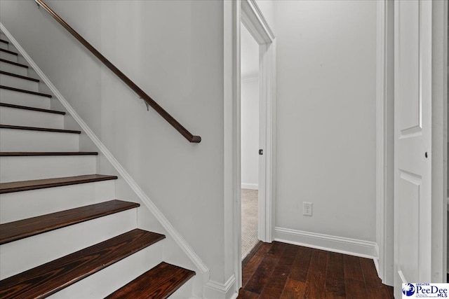 stairs with hardwood / wood-style floors and baseboards