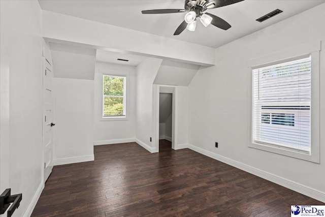 additional living space featuring ceiling fan, lofted ceiling, and dark hardwood / wood-style flooring