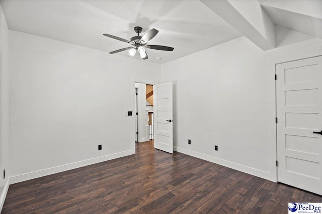 spare room featuring ceiling fan and dark hardwood / wood-style floors