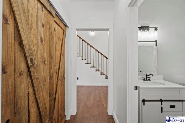 interior space with wood-type flooring and sink