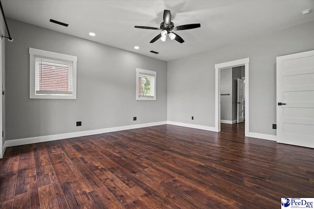 unfurnished bedroom with dark hardwood / wood-style flooring and ceiling fan