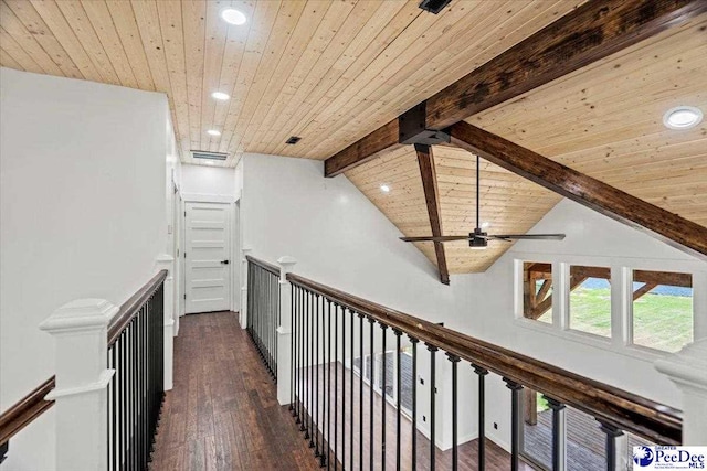 hall with dark wood-type flooring, beam ceiling, high vaulted ceiling, and wooden ceiling