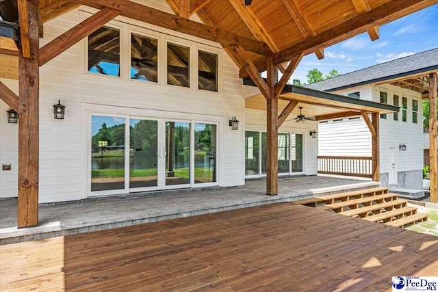 wooden terrace featuring ceiling fan