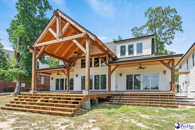 rear view of property featuring ceiling fan