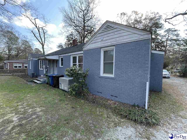 view of home's exterior featuring a yard