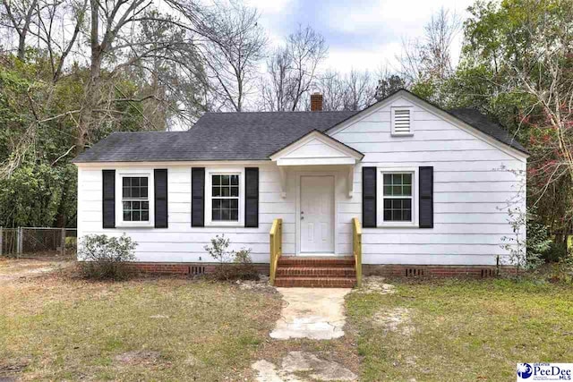 bungalow featuring crawl space, a shingled roof, a chimney, and fence