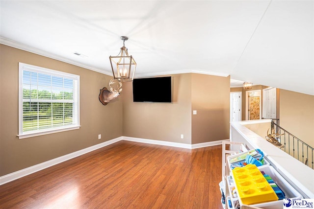 868 Moonshadow Ln, Darlington, SC 29540 - playroom with crown molding, wood finished floors, and a chandelier