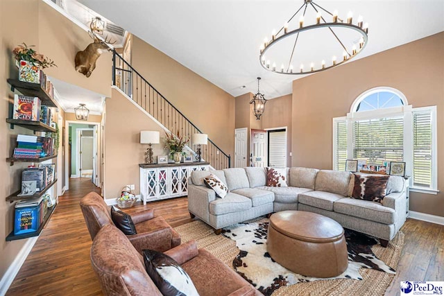 868 Moonshadow Ln, Darlington, SC 29540 - living room with a high ceiling, stairway, hardwood / wood-style flooring, and a chandelier
