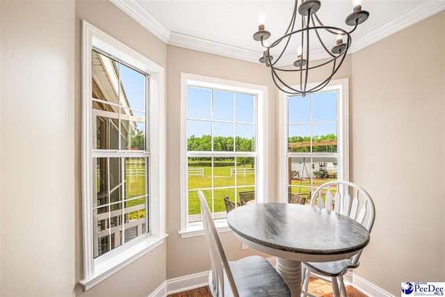 868 Moonshadow Ln, Darlington, SC 29540 - dining space with a chandelier, ornamental molding, and dark wood finished floors
