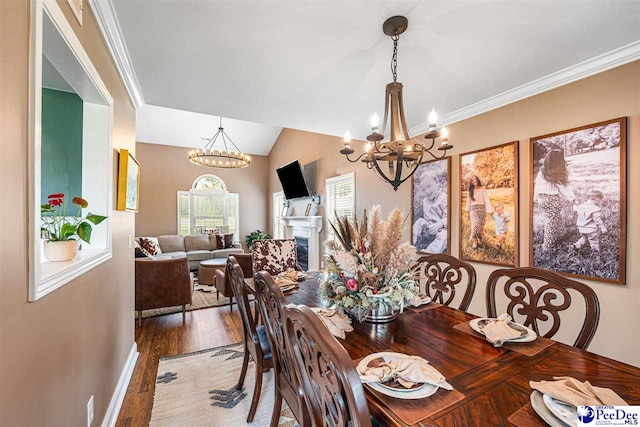 868 Moonshadow Ln, Darlington, SC 29540 - dining area with a chandelier, wood finished floors, vaulted ceiling, and ornamental molding