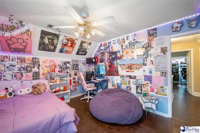 bedroom featuring ceiling fan, a textured ceiling, and baseboards