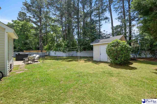 view of yard with a fenced backyard, an outdoor structure, an outdoor hangout area, and a shed