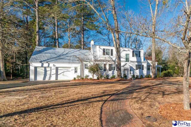 607 Third St, Cheraw, SC 29520 - view of front of property with a garage and a front yard