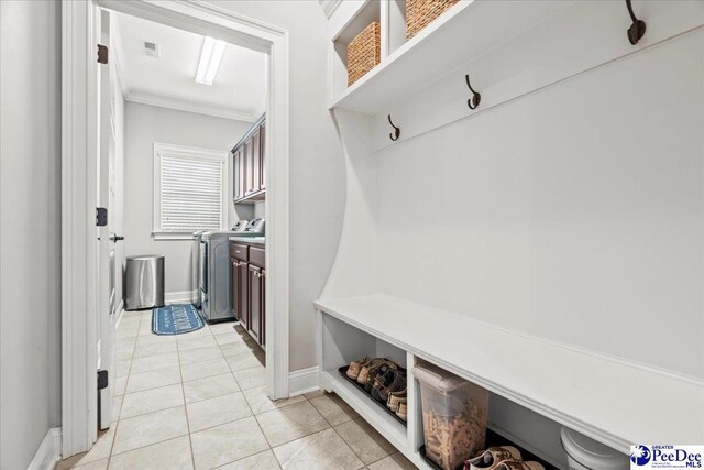 3106 Wainwright Ct, Florence, SC 29501 - mudroom with washer / clothes dryer, crown molding, light tile patterned floors, and baseboards