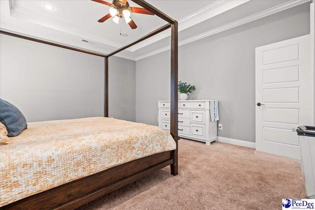 3106 Wainwright Ct, Florence, SC 29501 - bedroom featuring ornamental molding, light carpet, a tray ceiling, baseboards, and recessed lighting