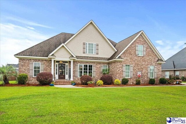 3106 Wainwright Ct, Florence, SC 29501 - view of front of property featuring brick siding, a front yard, and a shingled roof