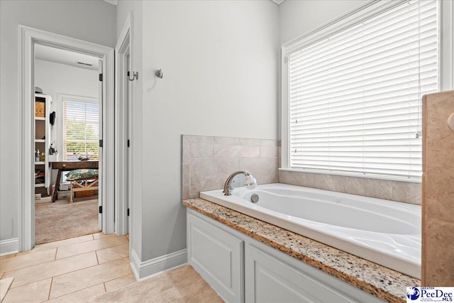 3106 Wainwright Ct, Florence, SC 29501 - full bath featuring a garden tub, tile patterned floors, and baseboards