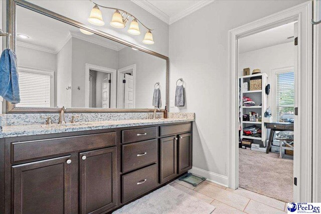 3106 Wainwright Ct, Florence, SC 29501 - full bathroom featuring double vanity, baseboards, crown molding, and tile patterned flooring