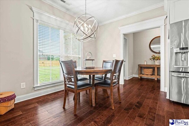 3106 Wainwright Ct, Florence, SC 29501 - dining room with a chandelier, dark wood finished floors, baseboards, and crown molding