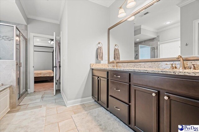 3106 Wainwright Ct, Florence, SC 29501 - ensuite bathroom featuring crown molding, double vanity, a stall shower, baseboards, and tile patterned floors