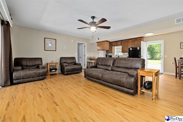 2963 Miss Annie Ct, Gresham, SC 29544 - living room featuring ceiling fan, visible vents, baseboards, and light wood-style floors