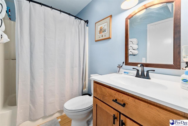 2963 Miss Annie Ct, Gresham, SC 29544 - full bath with vanity, shower / bath combo with shower curtain, toilet, and wood finished floors