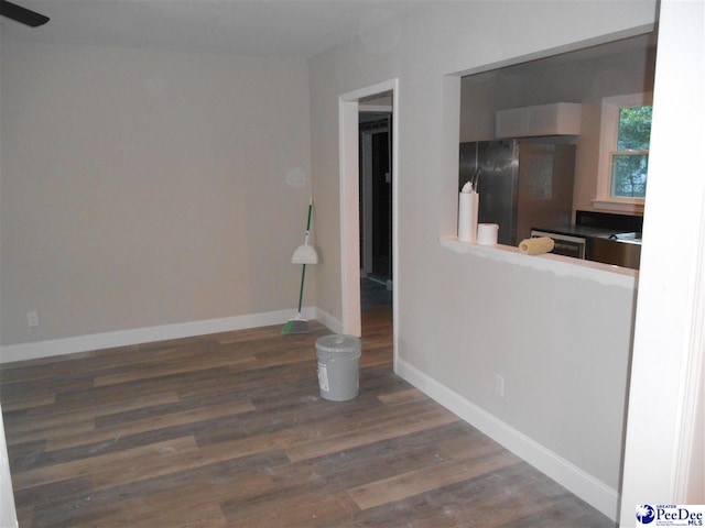 unfurnished living room with dark hardwood / wood-style floors