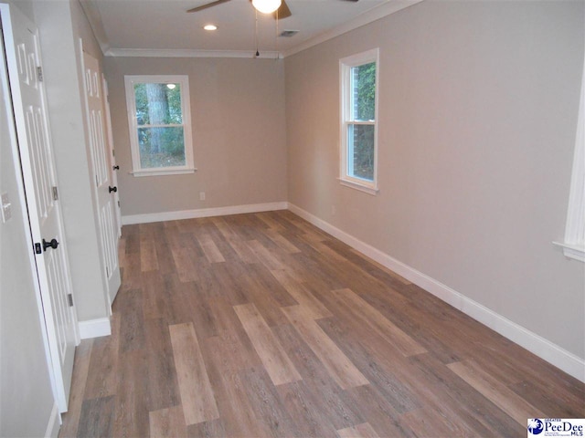 unfurnished room with crown molding, ceiling fan, and hardwood / wood-style floors