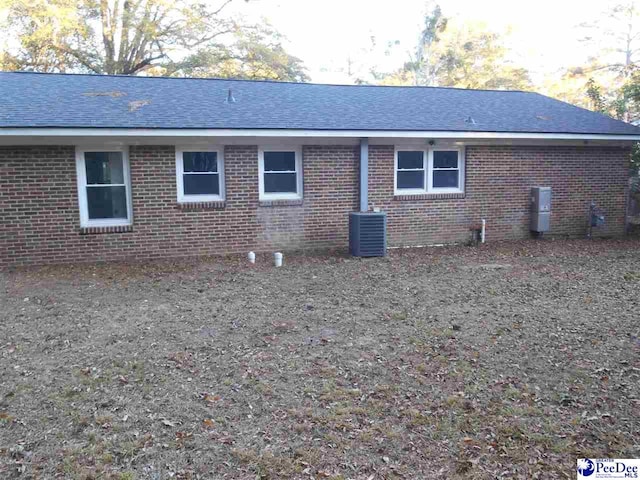 view of side of home featuring central air condition unit