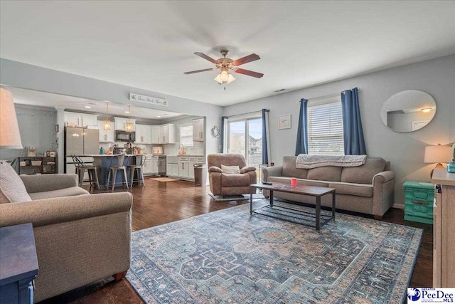 1200 Turtle Dove Dr, Effingham, SC 29541 - living area featuring a ceiling fan and dark wood-style flooring