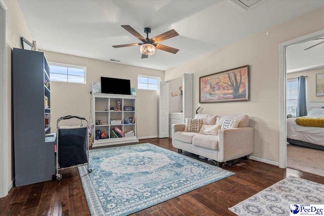 1200 Turtle Dove Dr, Effingham, SC 29541 - living area featuring a ceiling fan, healthy amount of natural light, wood finished floors, and baseboards