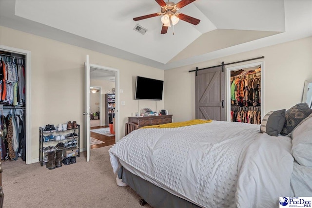 1200 Turtle Dove Dr, Effingham, SC 29541 - bedroom featuring a closet, a spacious closet, light carpet, vaulted ceiling, and a barn door
