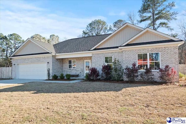 view of front facade featuring a front lawn, an attached garage, brick siding, and concrete driveway