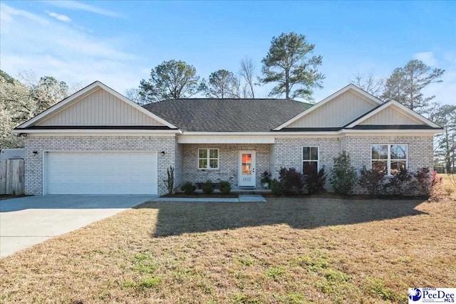 view of front of house featuring brick siding, board and batten siding, concrete driveway, a front yard, and an attached garage