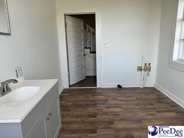 bathroom with vanity and hardwood / wood-style floors