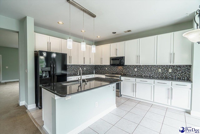 kitchen with decorative light fixtures, white cabinetry, sink, decorative backsplash, and black appliances