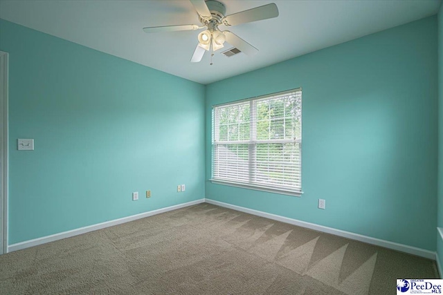 unfurnished room with carpet and ceiling fan